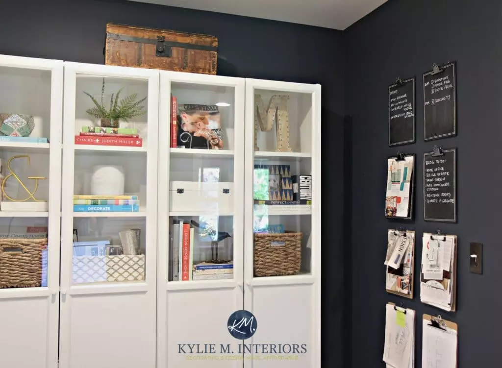 Benjamin Moore Hale Navy in small den office with zebra rug, beige tan sofa and gallery wall. Kylie M Interiors Edesign, DIY update ideas
