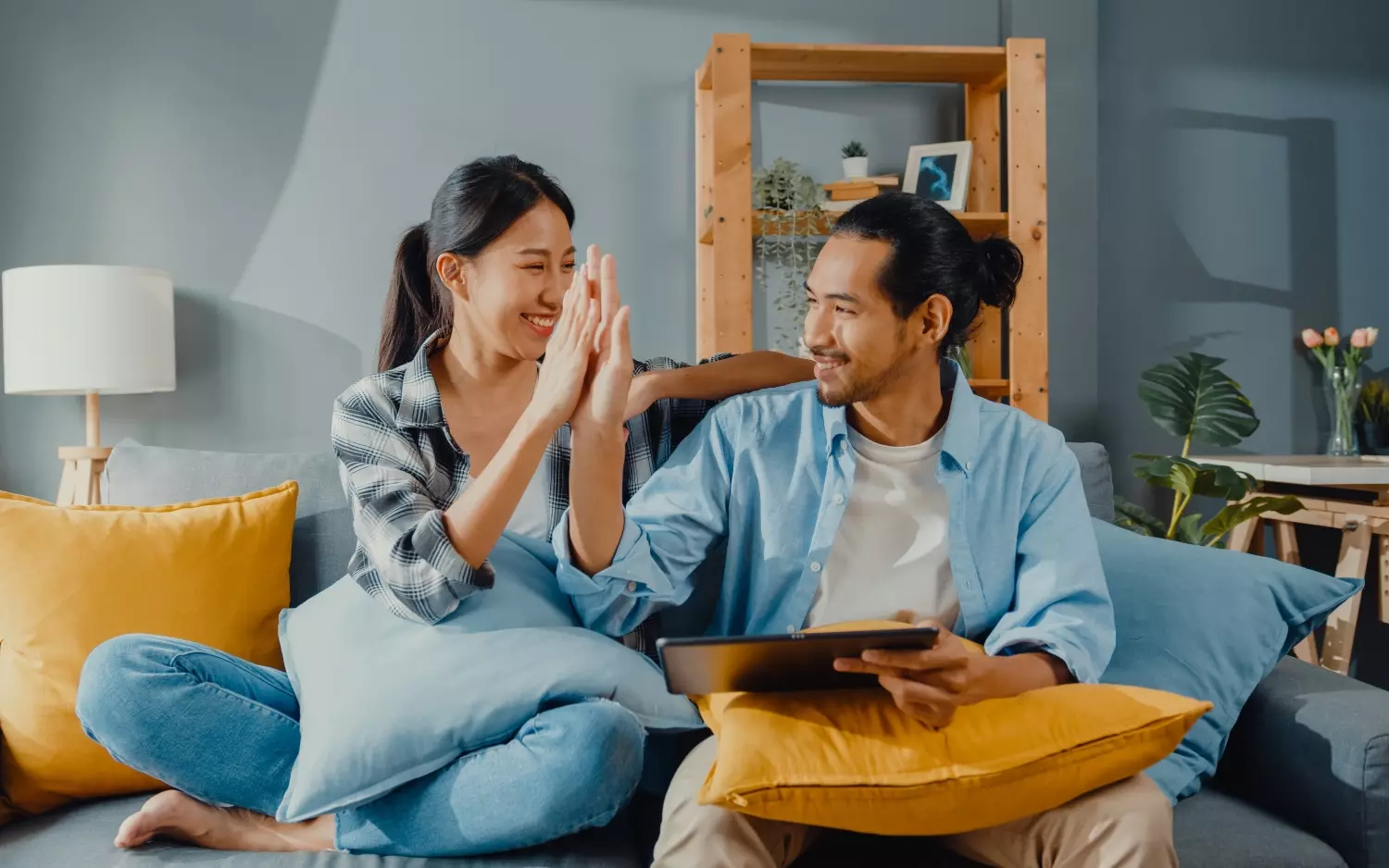 young attractive couple man and woman sit on couch (1)