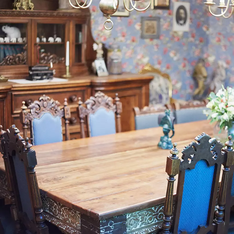 Sleek iron furniture and pendant lights make this dining room simple and spacious