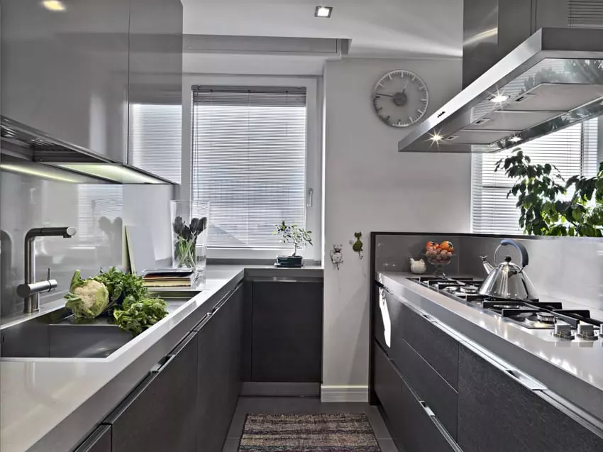 Kitchen with large island, wire globe lighting, and neon backlights