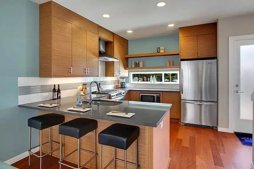 High ceiling kitchen with colored concrete flooring