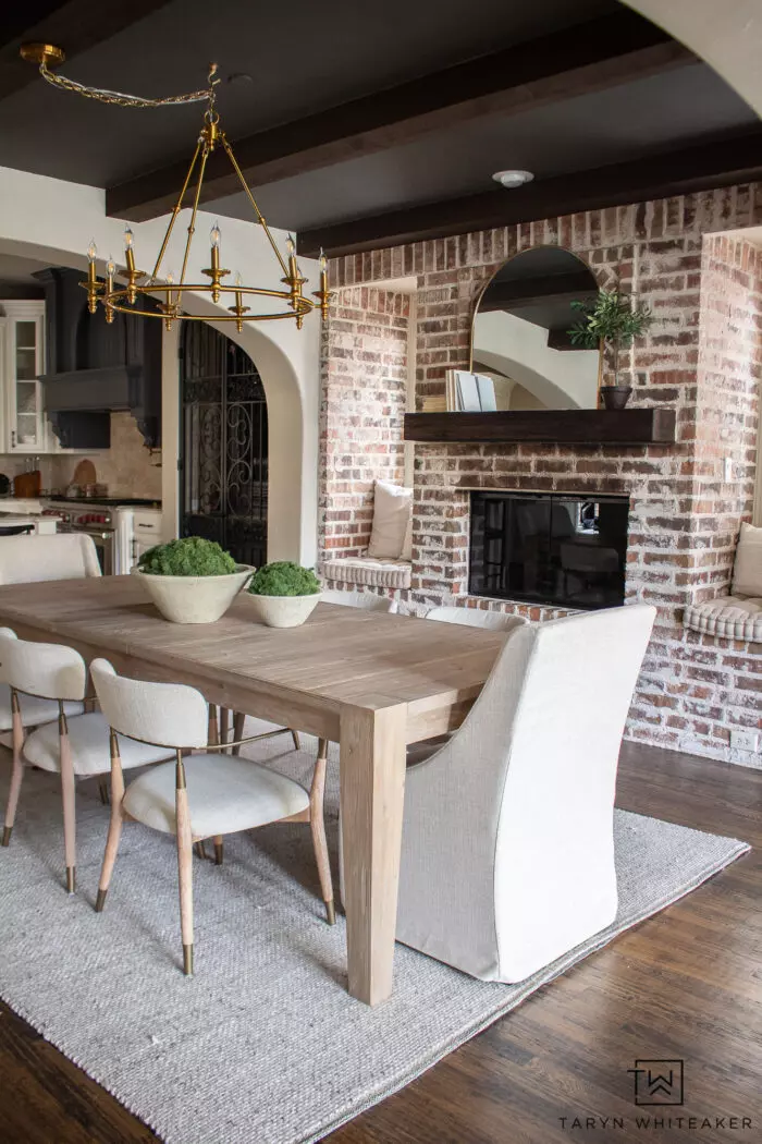 Neutral dining room decor with lots of different textures and gold accents.