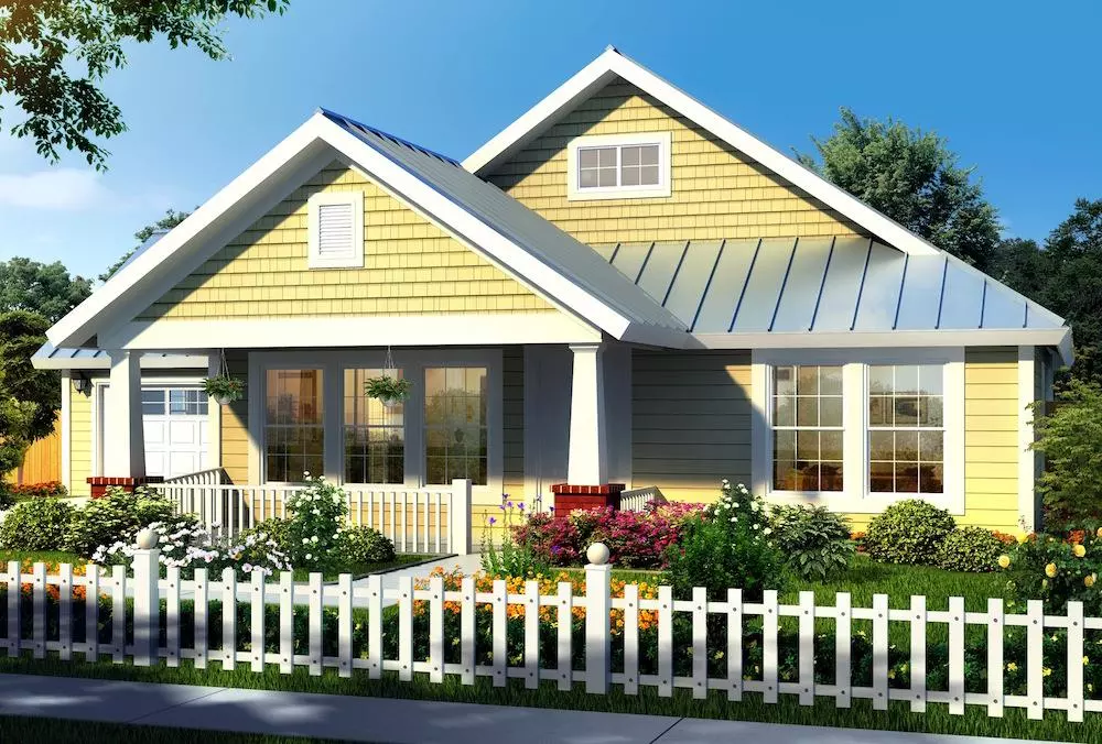 Small house with 3 bedrooms and 2 baths sided in yellow shakes and clapboards