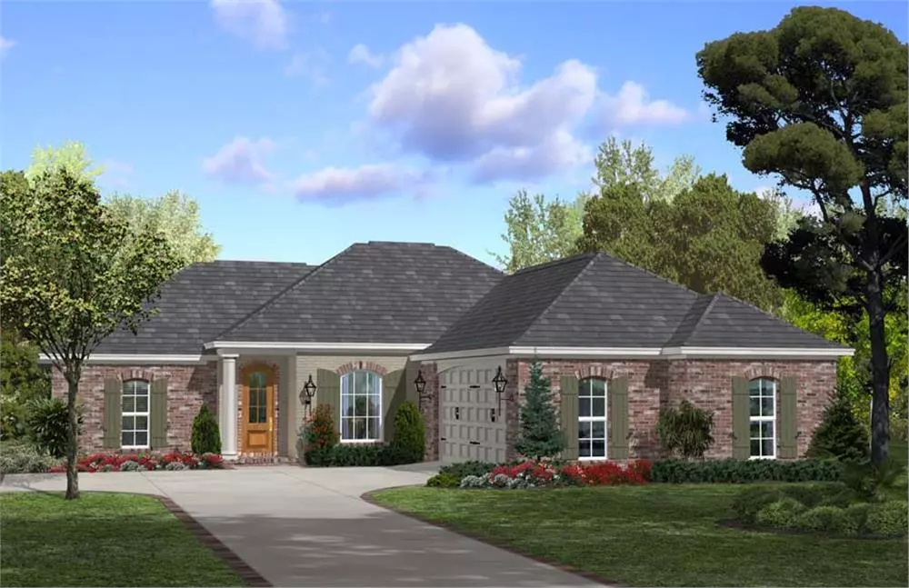 L-shape Acadian style home with brick siding and hip roof