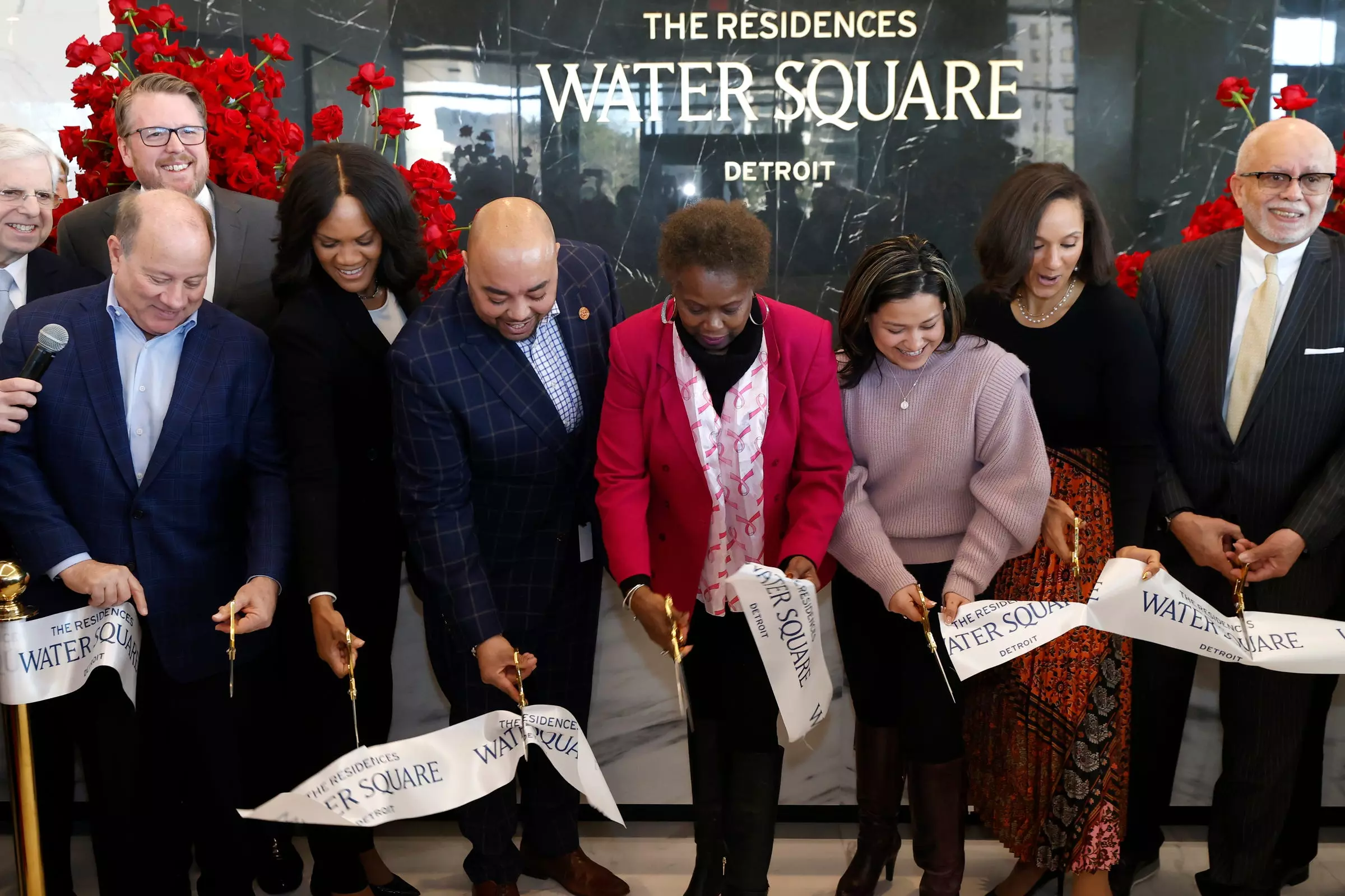 Various dignitaries ceremoniously cut the ribbon at The Residences at Water Square