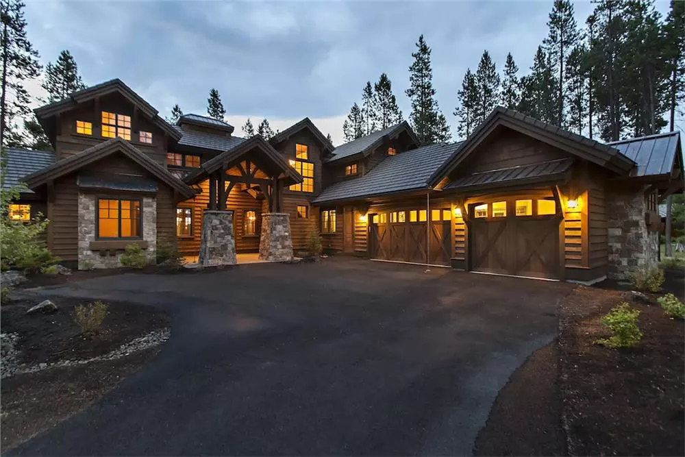 Rustic luxury home with stone and wood siding