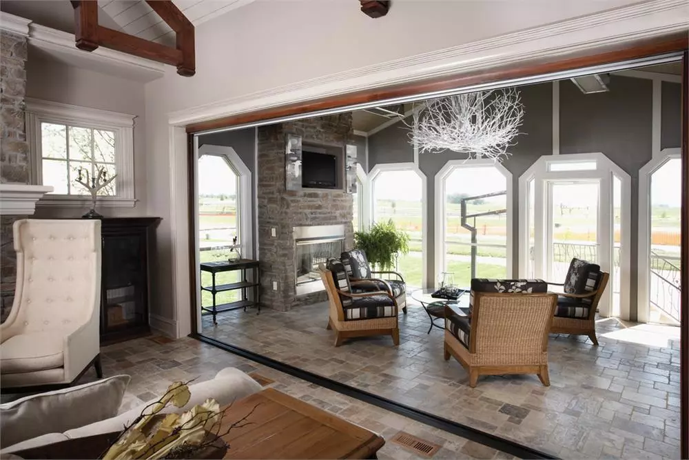 Wall of sliding glass doors that open onto covered patio