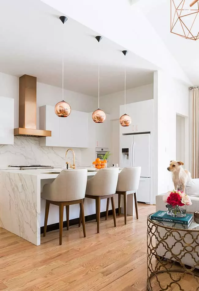 Detailed Vignette of Copper Pendant Lights and Range Hood design by Laura U