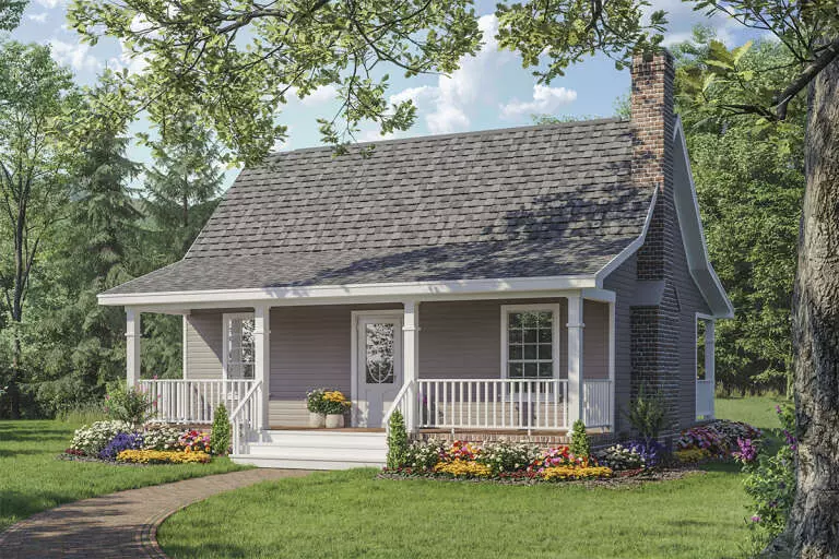 A tiny house on the beach with a covered front porch