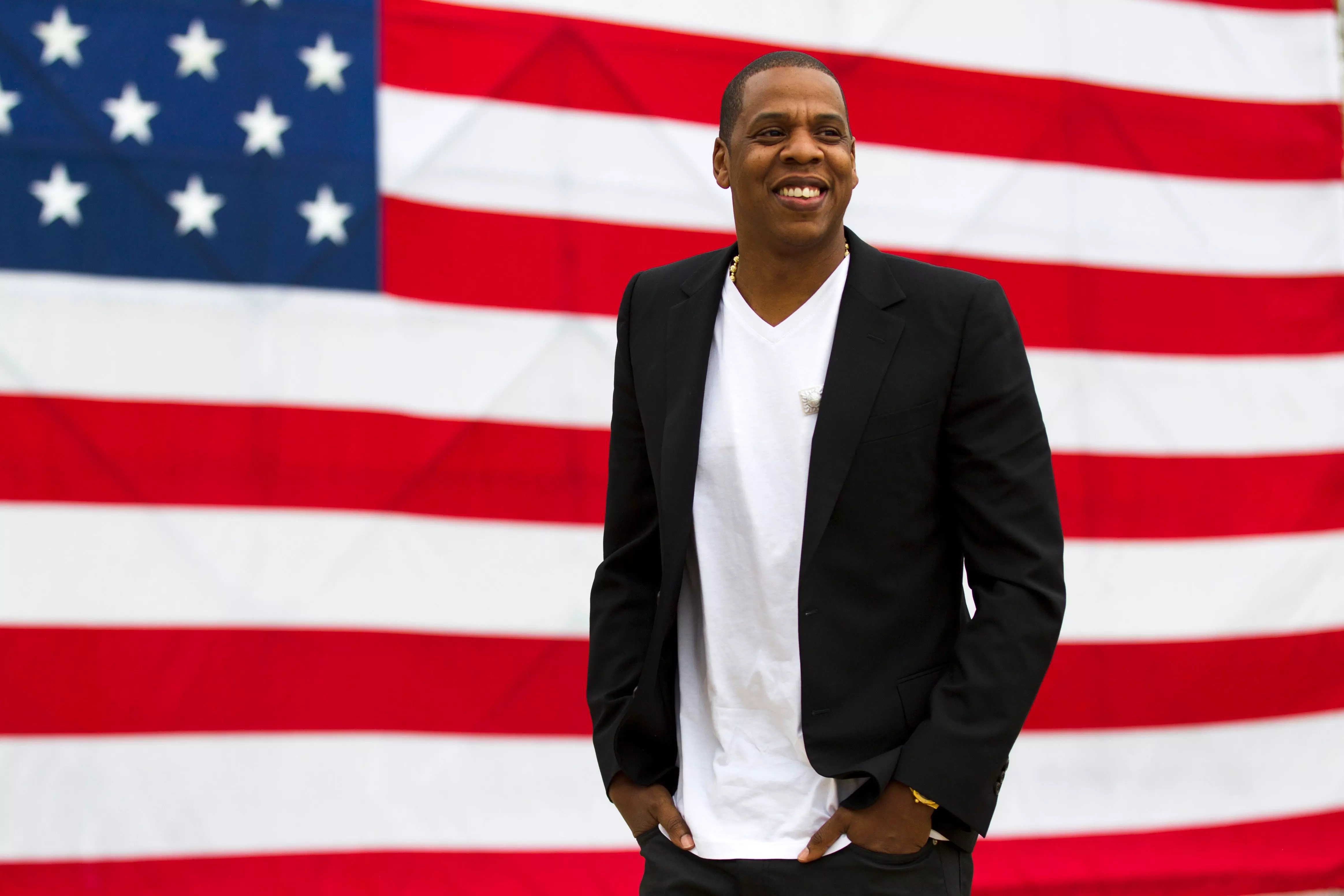 FILE - In this May 14, 2012 file photo, entertainer Shawn "Jay-Z" Carter smiles in between interviews, after a news conference at Philadelphia Museum of Art in Philadelphia. Jay-Z’s annual festival in Philadelphia, Made in America, won’t take place Labor Day weekend due to the coronavirus pandemic. In a statement Wednesday, July 1, 2020, the rap mogul’s Roc Nation company said they plan to produce the popular festival in 2021. (AP Photo/Matt Rourke, file) ORG XMIT: NYET307